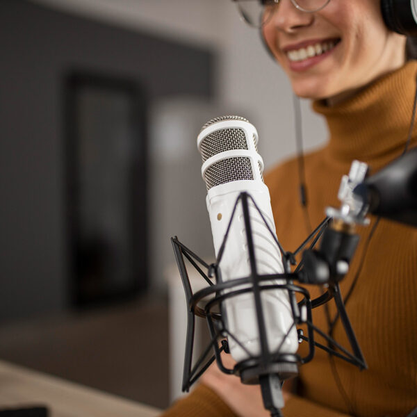 Best storytelling podcasts list - a young woman behind a mic.