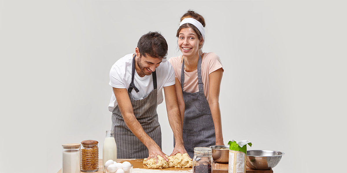 young couple cooking together