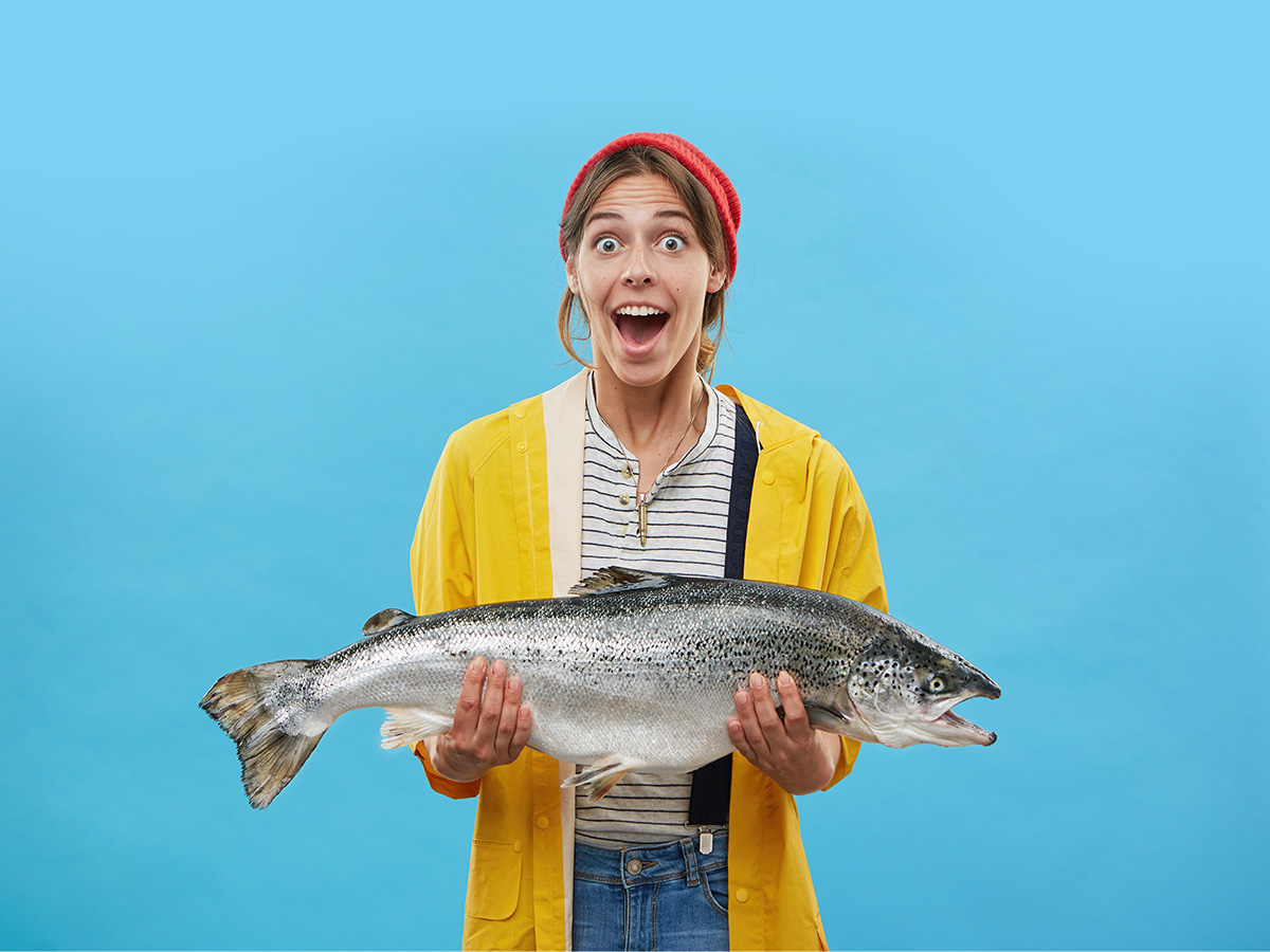 Fish puns - Woman holding fish